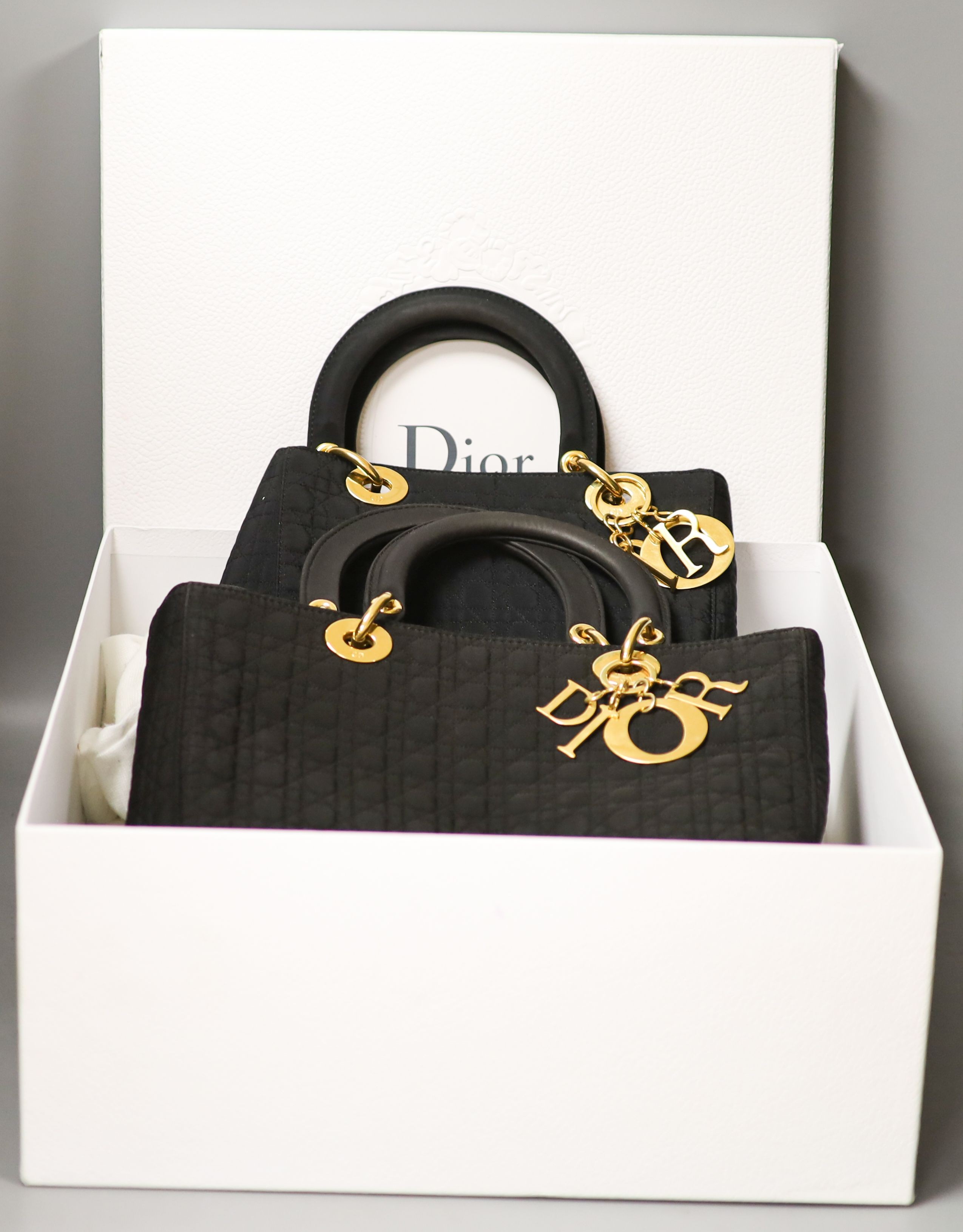 Two Dior Cannage nylon handbags from 1998, bought from Harrods, one is a smaller evening bag, the other a daytime bag